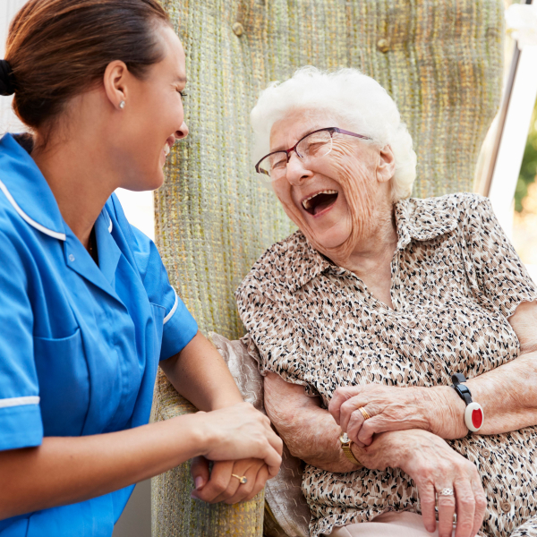 A doctor and an elderly patient have a pleasant interaction