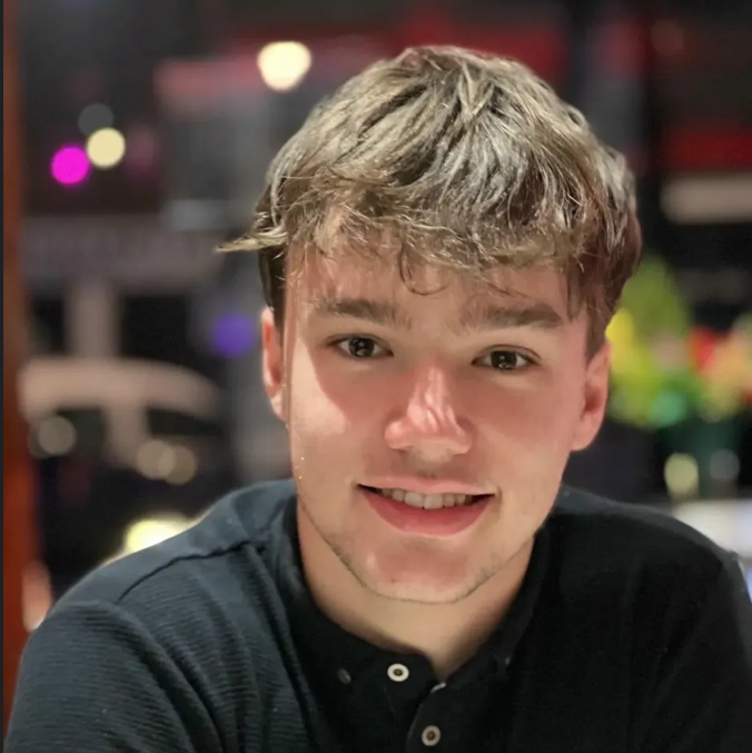 Young male smiling towards camera