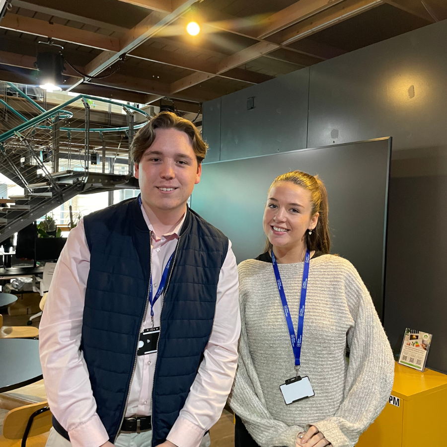 Aaron Clarke and Skye Stephens, Blue Lozenge's two new apprentices, smiling together at a the office.