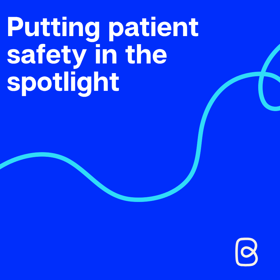 Blue graphic with white bold text reading "Putting patient safety in the spotlight", with a teal wavy line design and the Patient Safety Commissioner logo in the bottom right corner.